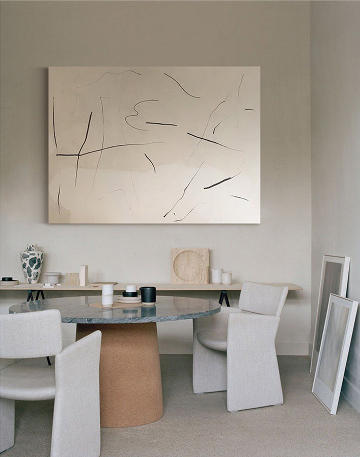Minimalist neutral abstract wall art displayed in a modern dining room
