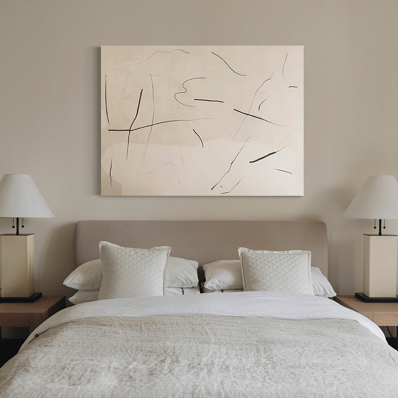 Unframed minimalist abstract canvas displayed above a neutral bedroom